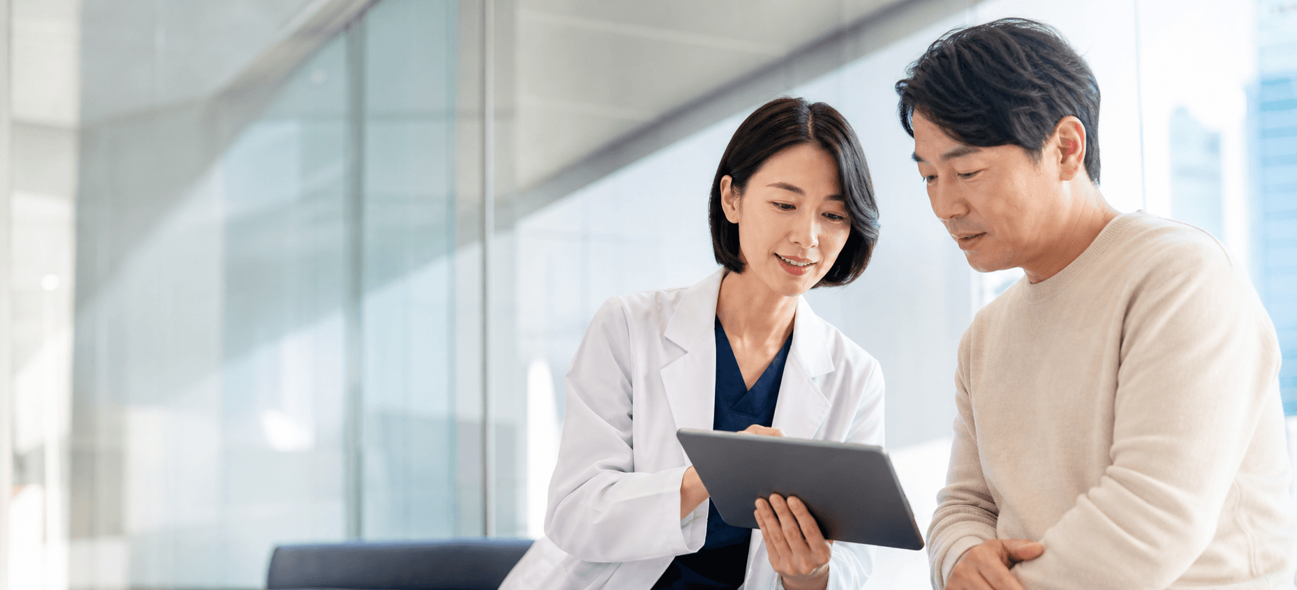 Physician reviewing clinical information in a contemporary hospital setting